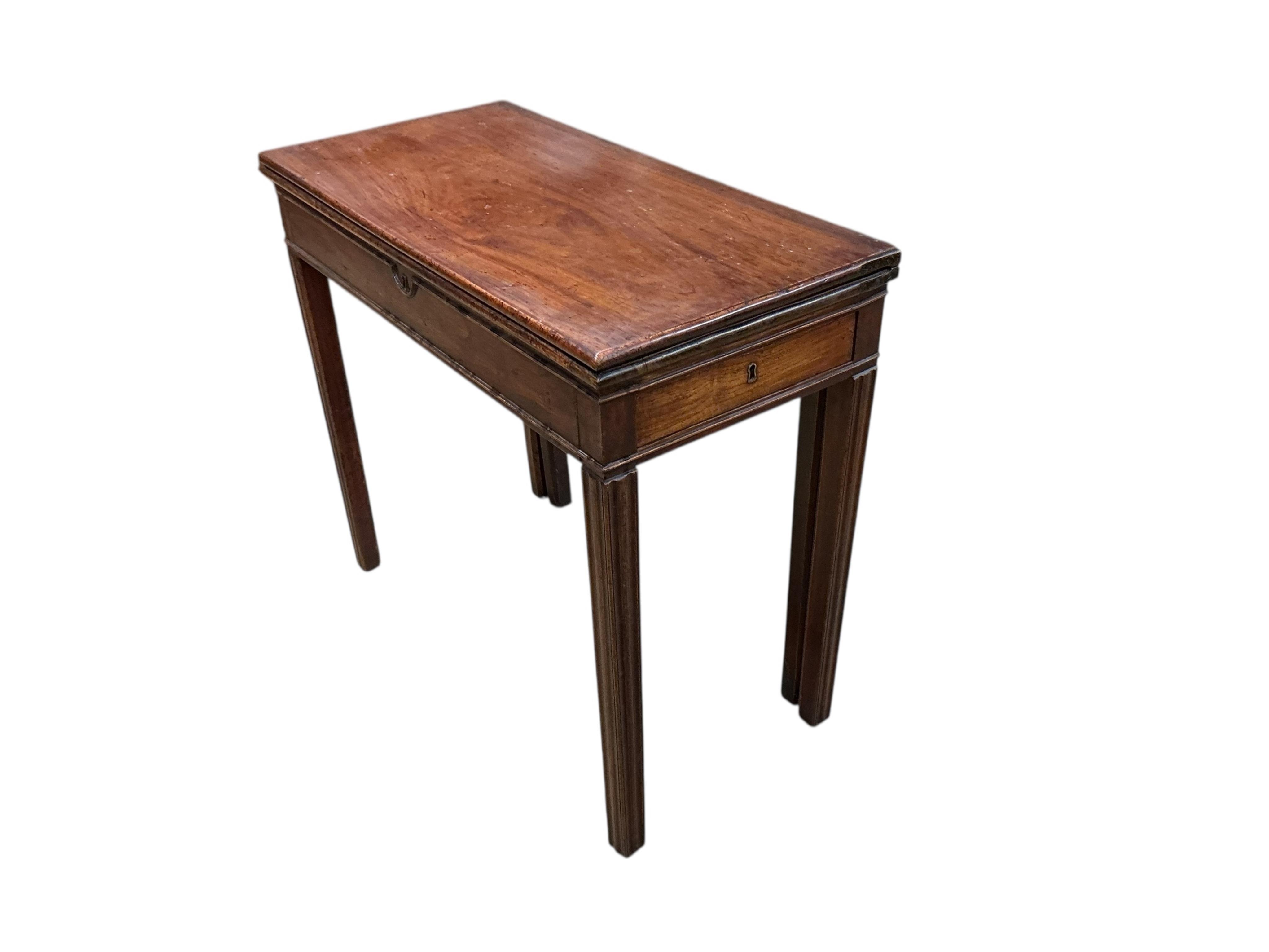A George III rectangular mahogany and elm folding card table, width 84cm, depth 41cm, height 75cm